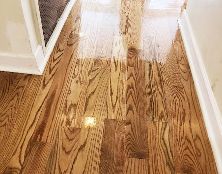 Hardwood floor refinished with a dark stain
