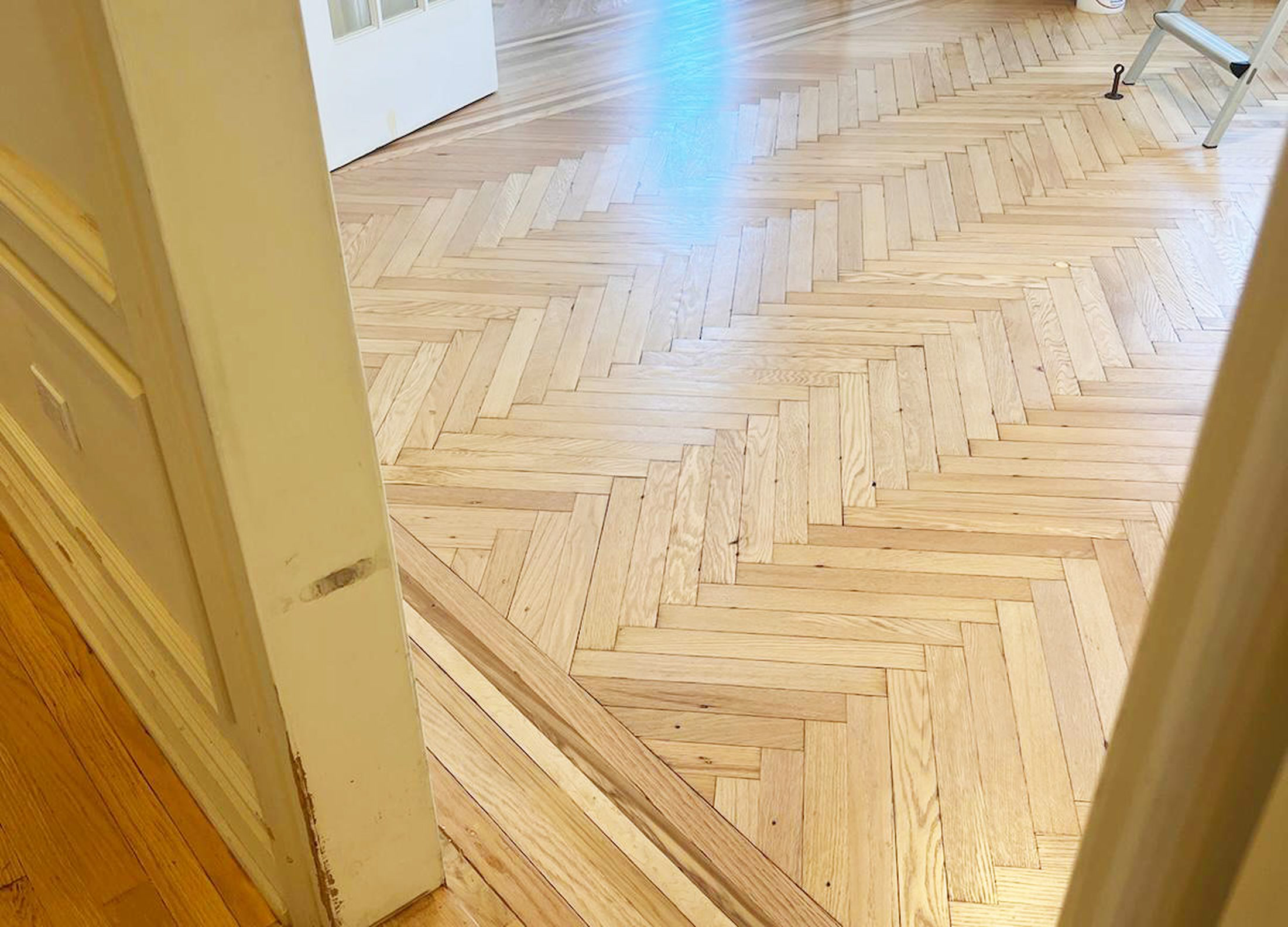 Herringbone parquet flooring and custom stairs installation in Brooklyn and Nassau