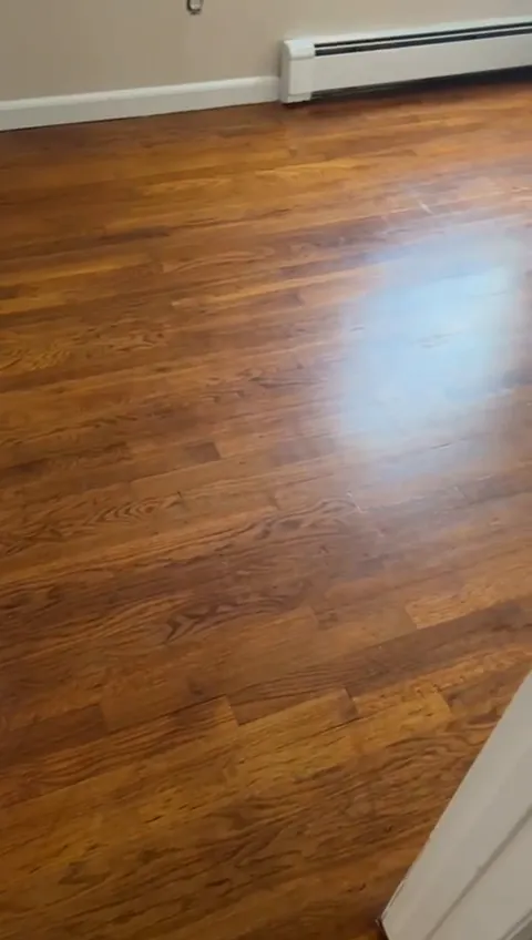 Room with stained strip hardwood floor and gloss finish in a Sheepshead Bay, Brooklyn house