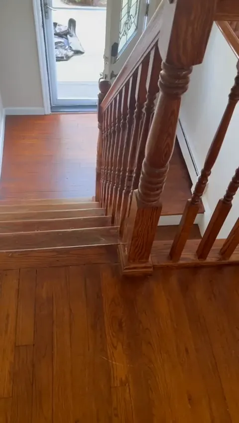 Staircase and landing with stained wood balusters in a Sheepshead Bay, Brooklyn house