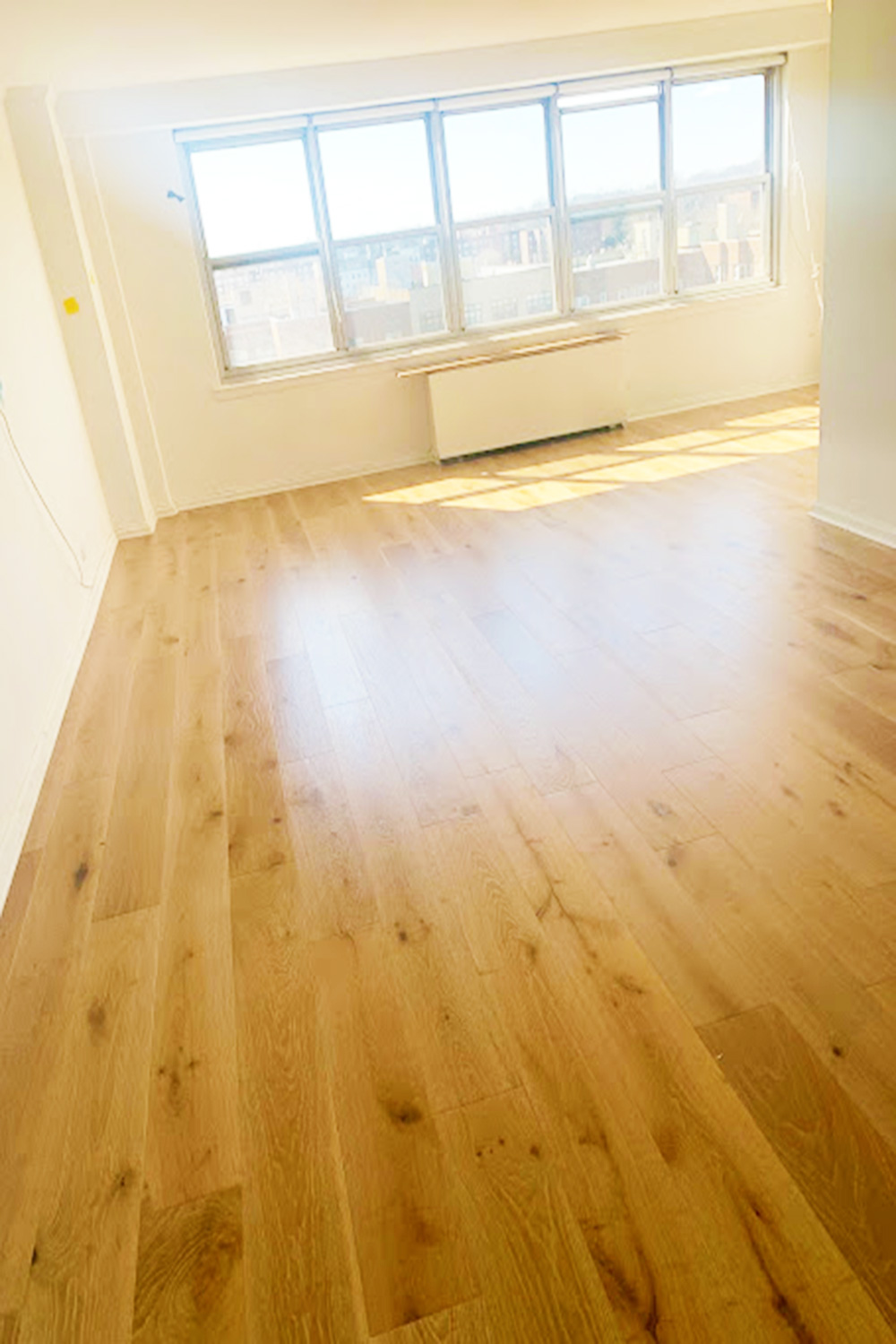 Wide-plank hardwood floor installed