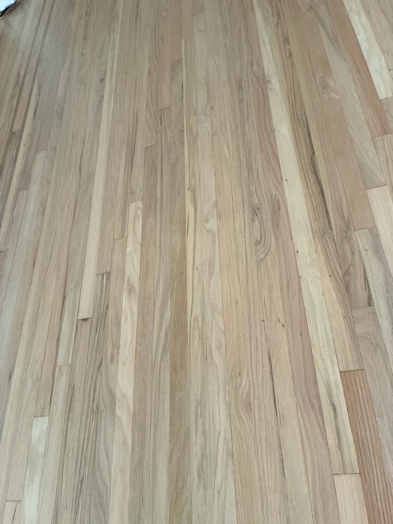 Close view of the new red oak before the finish, bare grain
