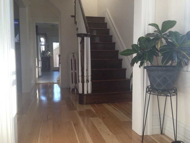 new-install-hardwood-floor-with-steps-and-rails